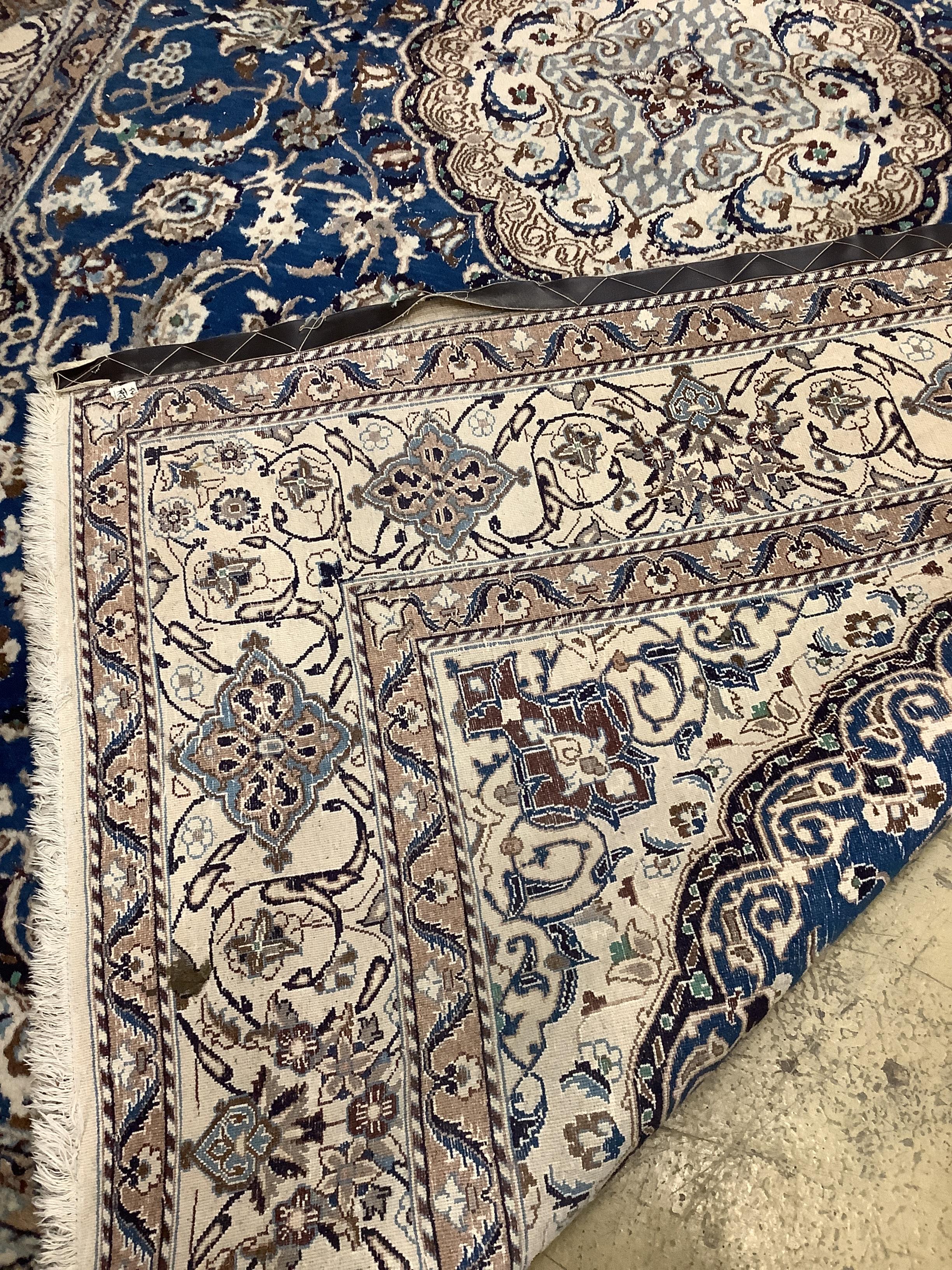 A Kashan style blue ground carpet, 340 x 244cm (a.f.)